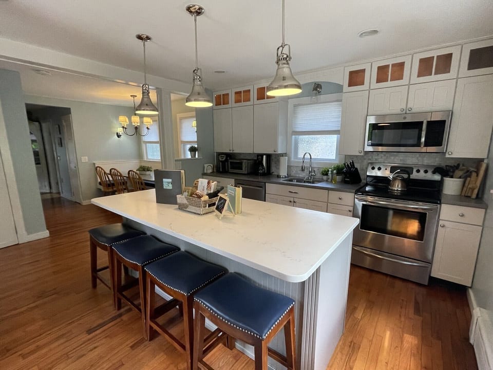 Well stocked eat-in kitchen with stainless appliances. 