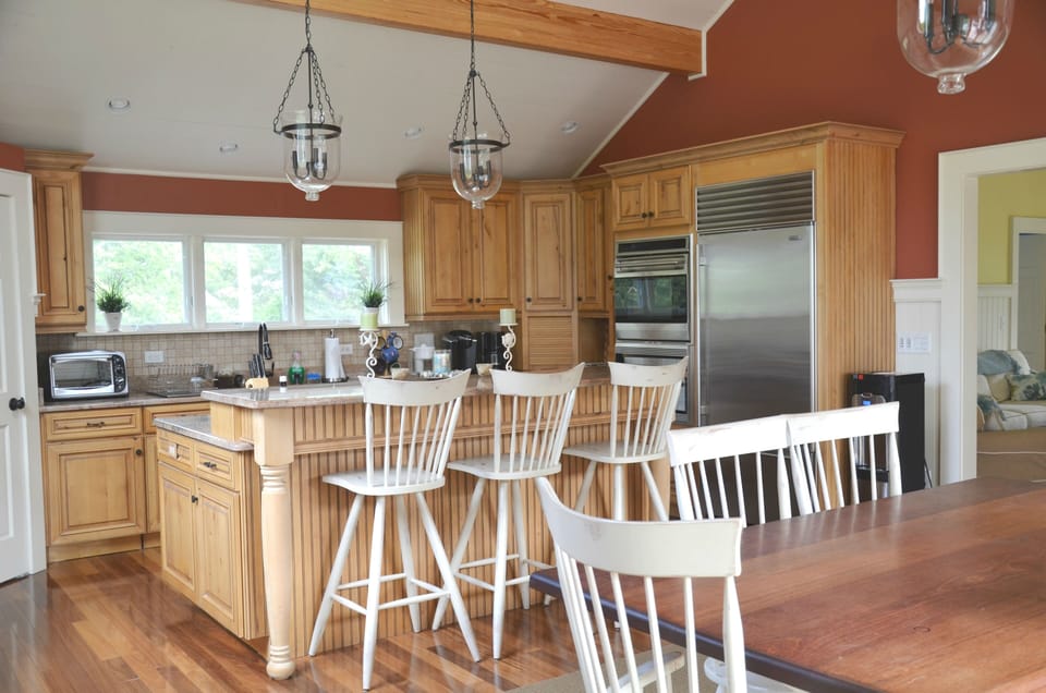 Large island, granite counters, high-end stainless appliances and a farm sink