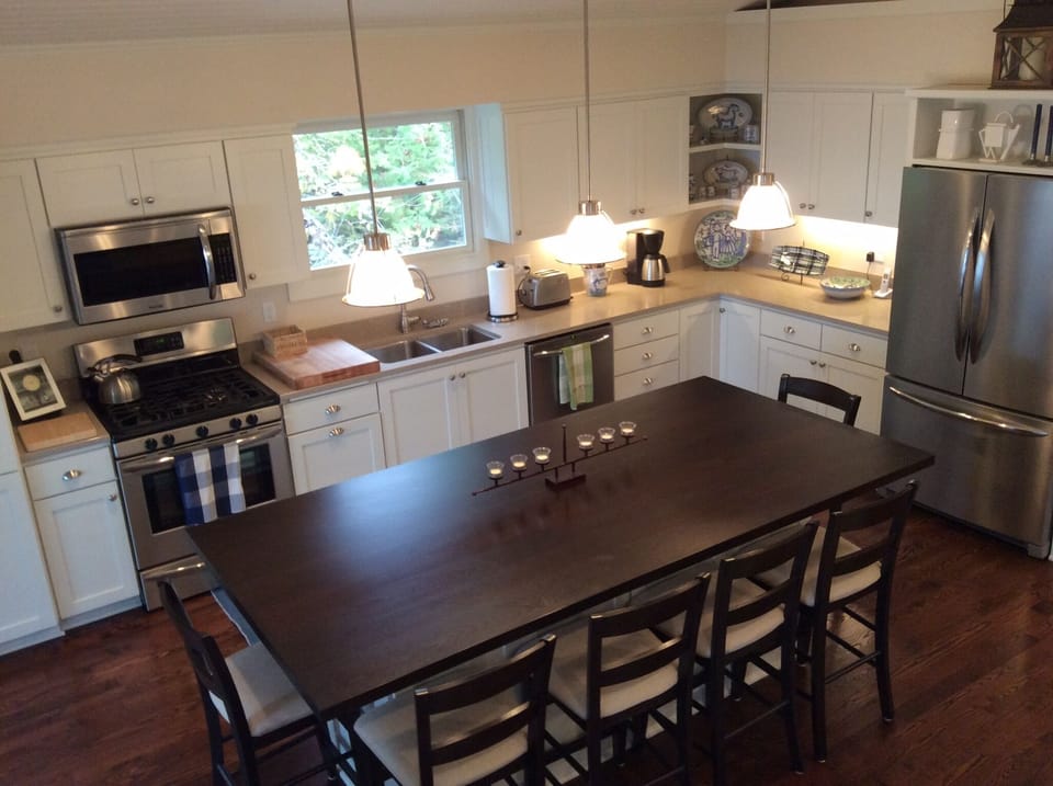 The kitchen with a central island that seats 8.