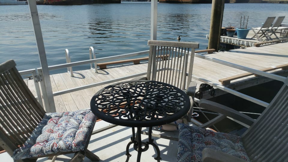 Outdoor deck with table and chairs.