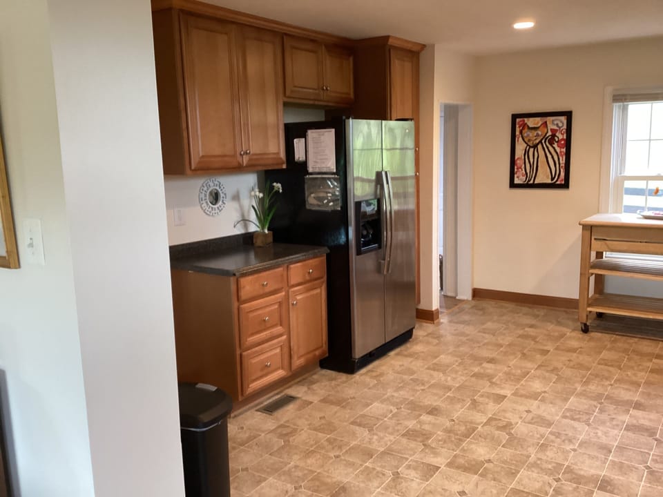 Full-size refrigerator and additional kitchen workspace