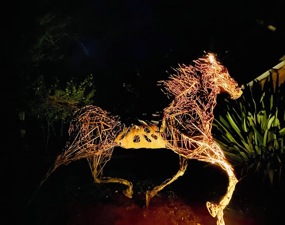 sculpture in the garden at night
