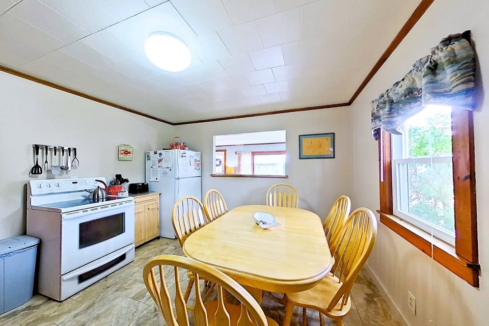 Kitchen table, stove and refrigerator