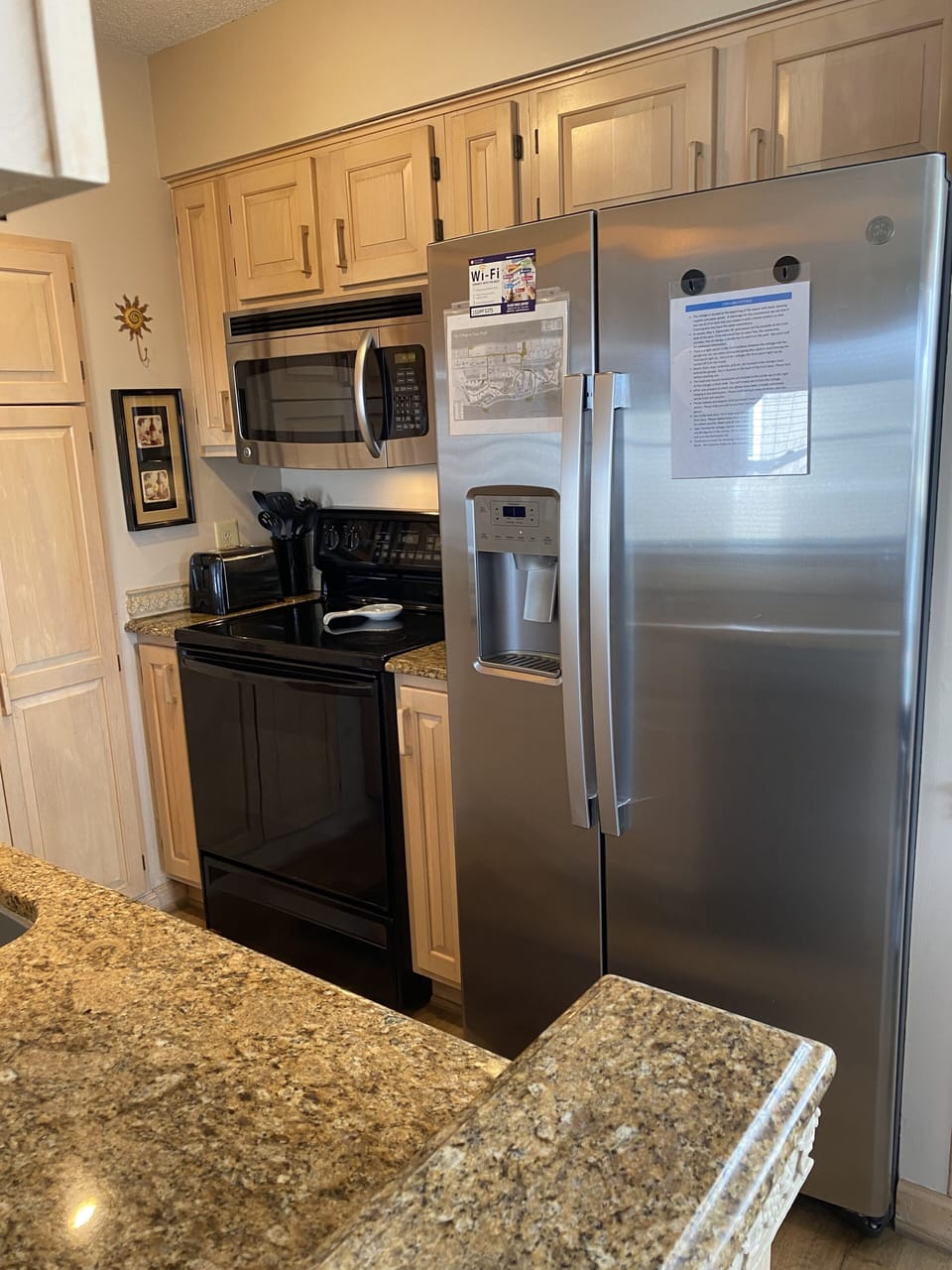 Kitchen with full size appliances and granite countertops 
