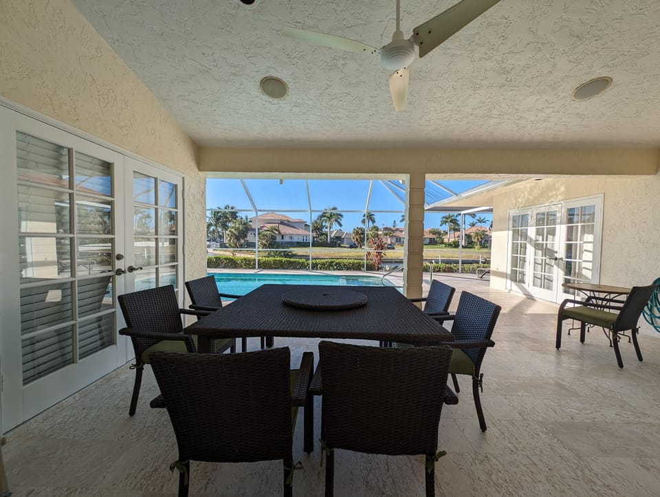 Outdoor dining area by pool.