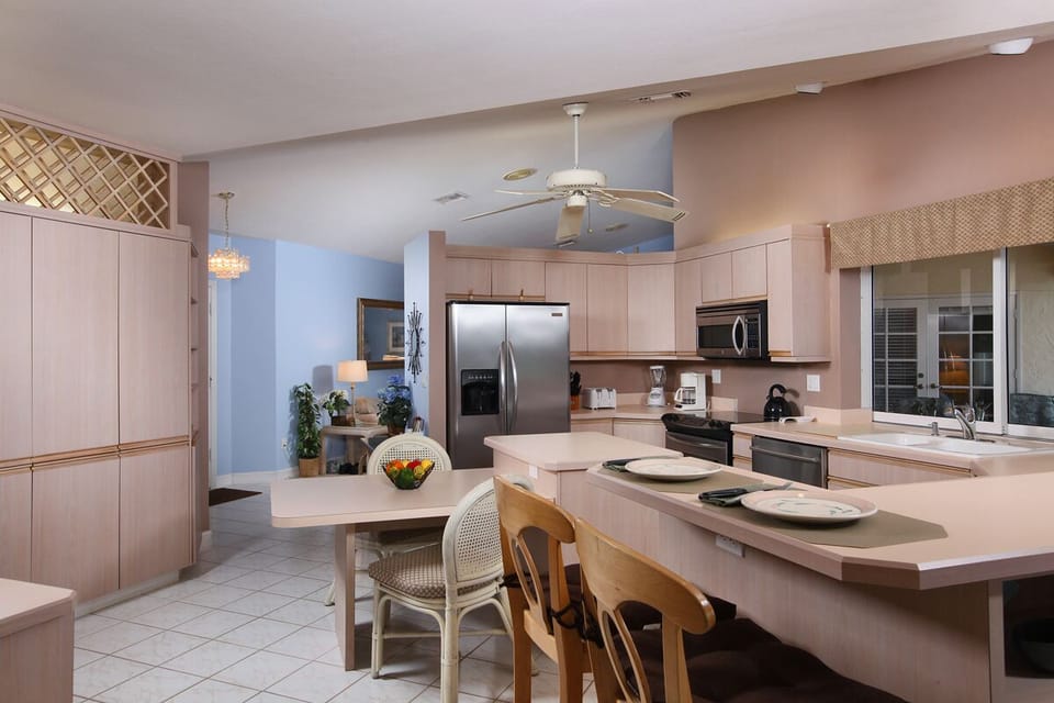 Kitchen table and breakfast bar with stool seating.