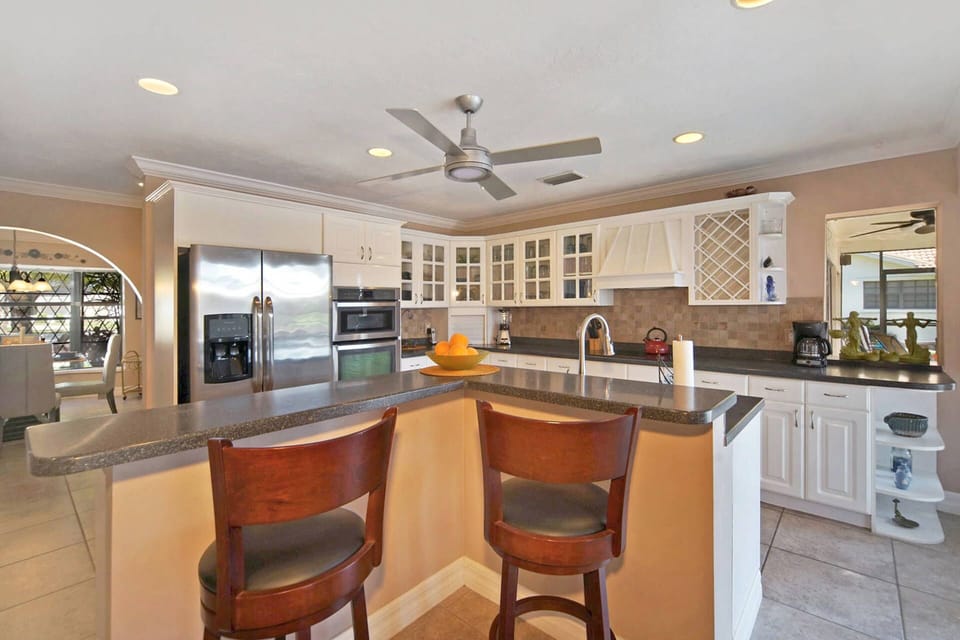 The fully-equipped kitchen also has room for 2 at the breakfast bar