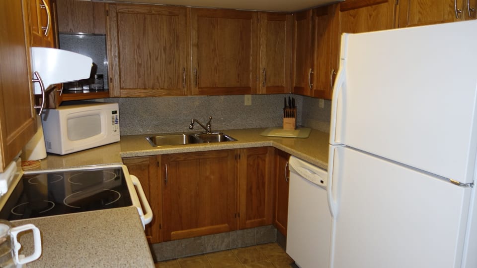 Kitchen with major appliances and utensils/dishes