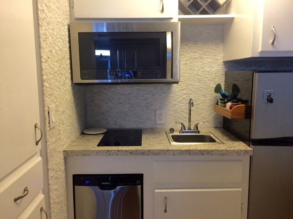 Kitchenette: Sink, Counter, Dishwasher,  Stove, Convection Microwave, Frig