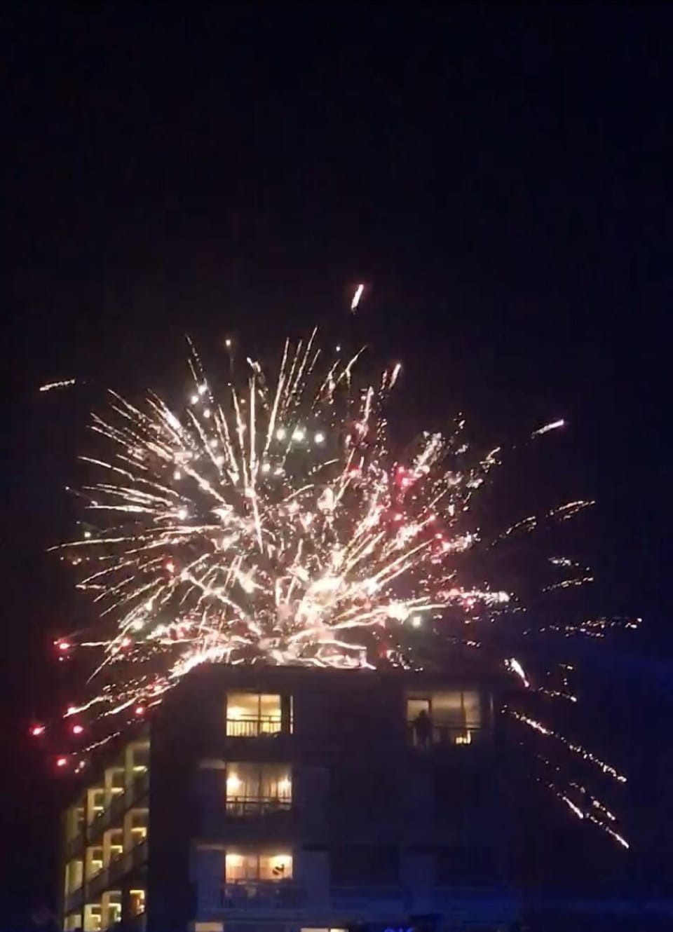 Fireworks display from the Halifax River seen above building.