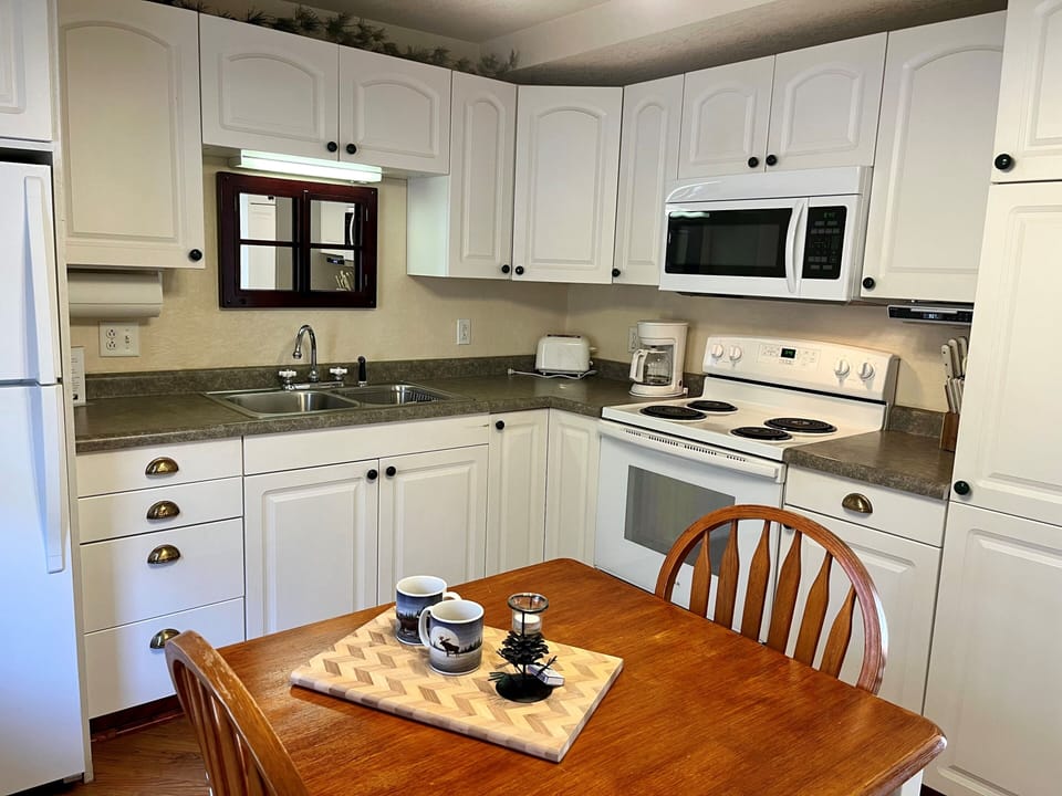 Kitchen
Picture yourself making a romantic meal for that special someone. Cottage #2 is complete with a full kitchen that includes a microwave, stove, oven, and refrigerator.