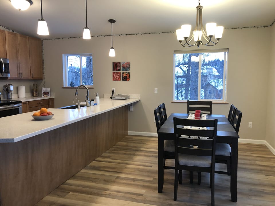 Dining rooms and kitchen. Seating for more at the bar!