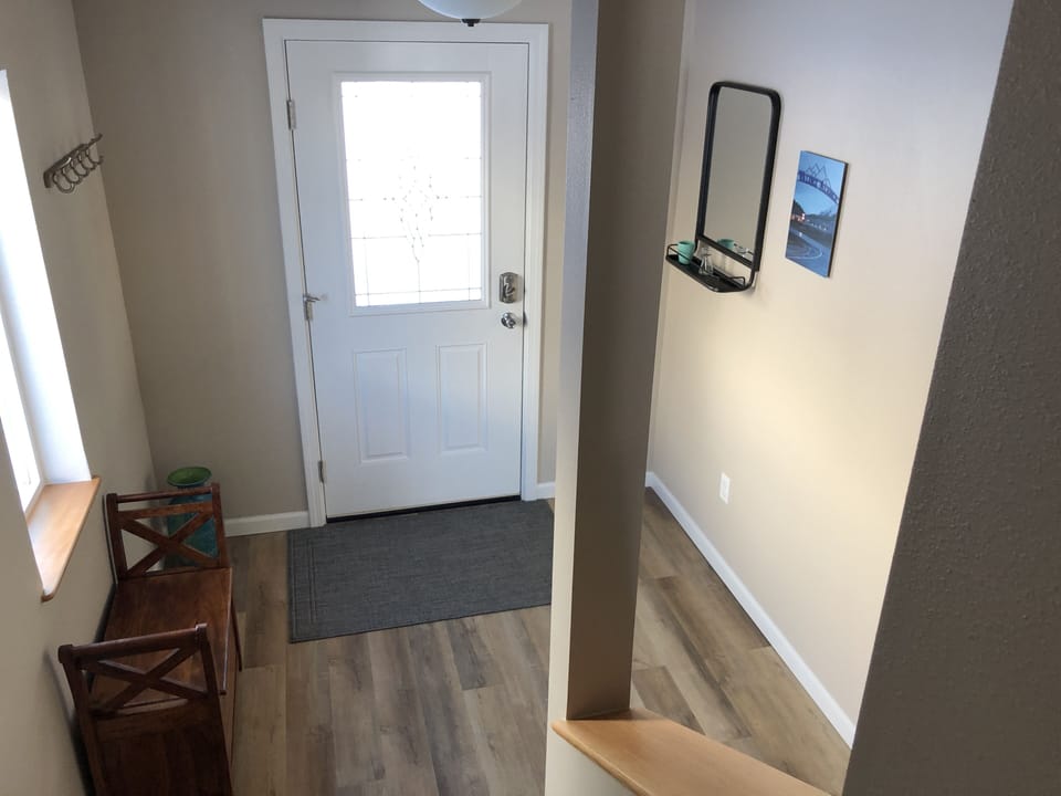 View of entrance from steps going upstairs.