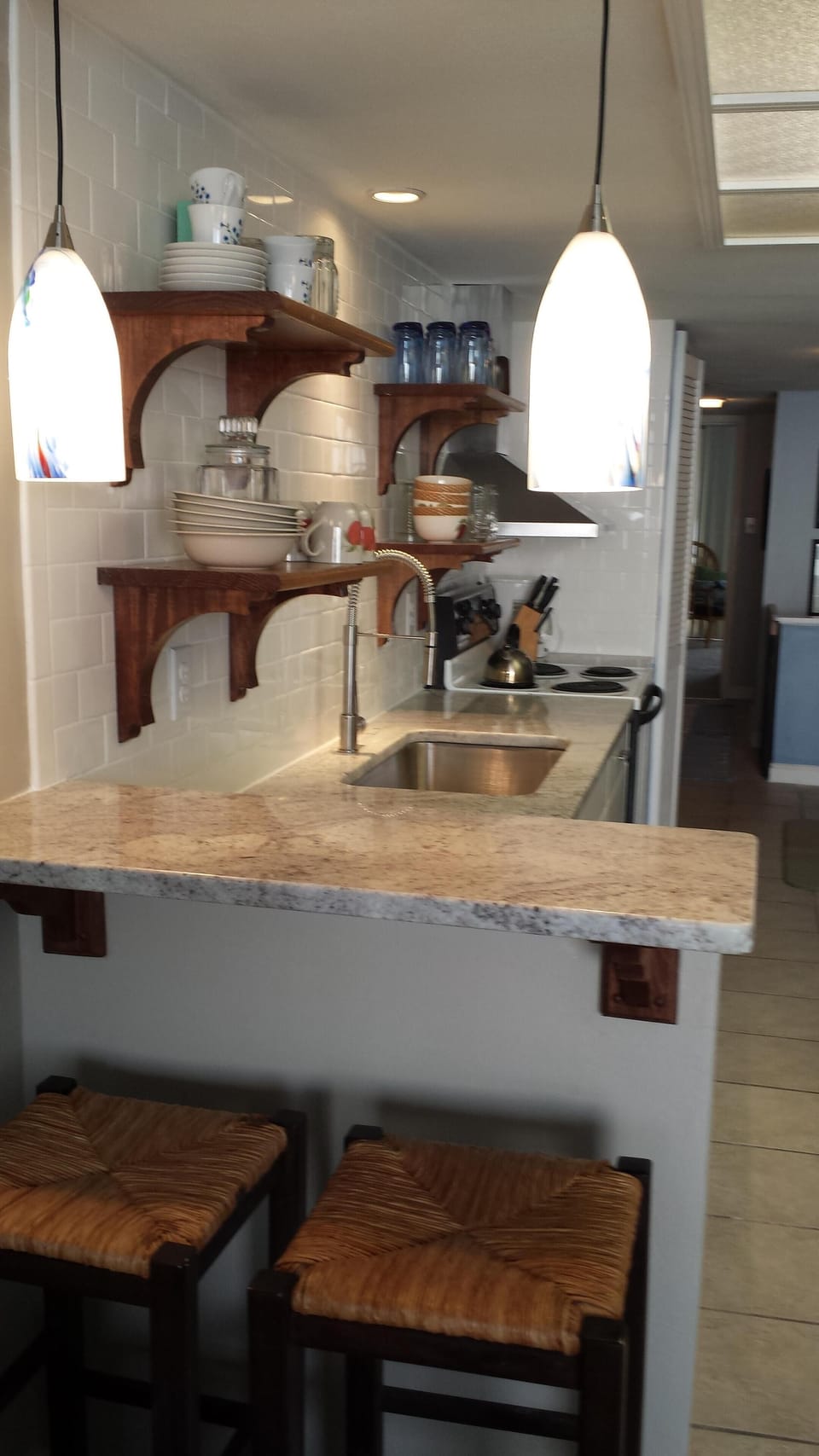 Deep oversized sink w/commercial pull out faucet, open shelves for easy access