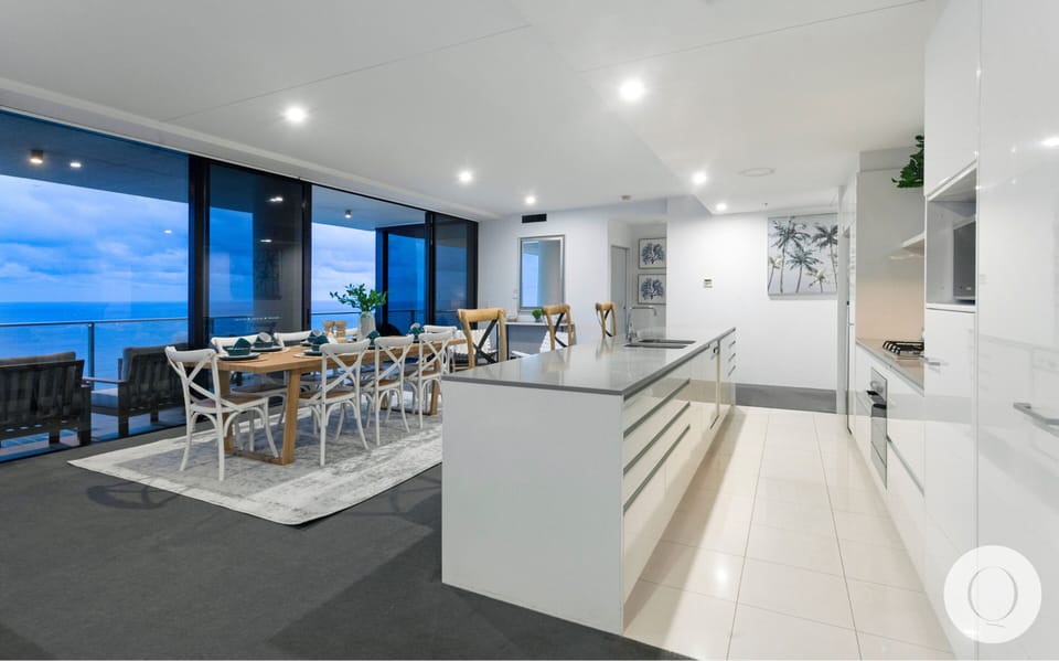 Fully equipped modern kitchen is right next to the dining area and the balcony