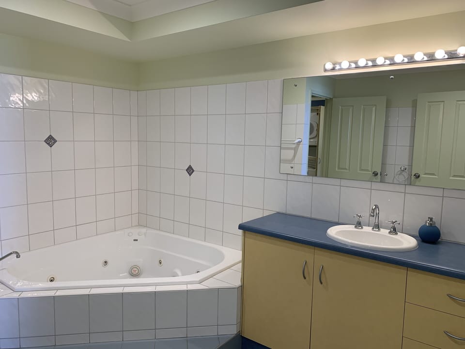 Bathroom with corner spa