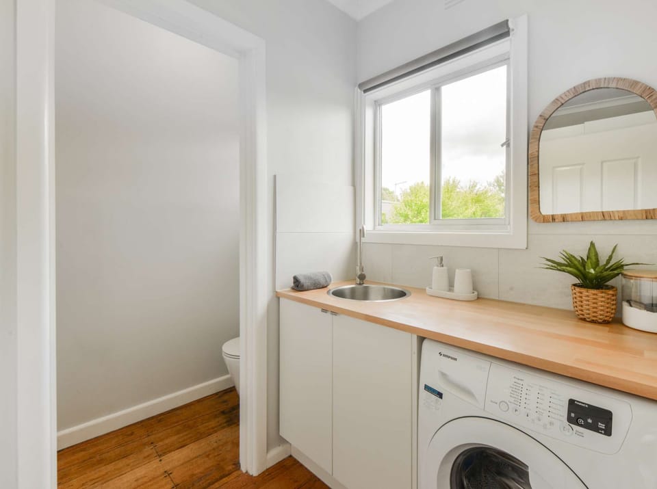Laundry with washing machine and second toilet