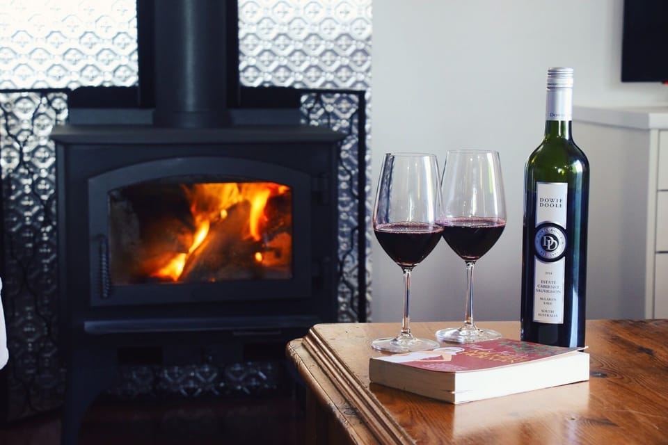 Sit by the fire with a glass of wine from our vineyard and a good book