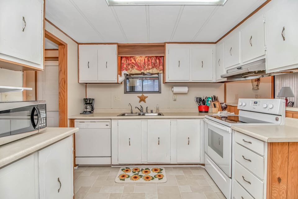Kitchen with all appliances  &  Laundry  entrance.
