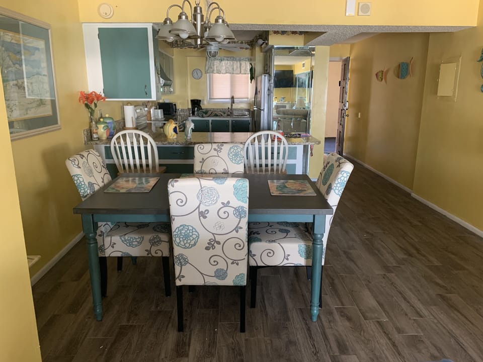 Dining Room Table with 4 chairs.  2 bar stools at kitchen bar.