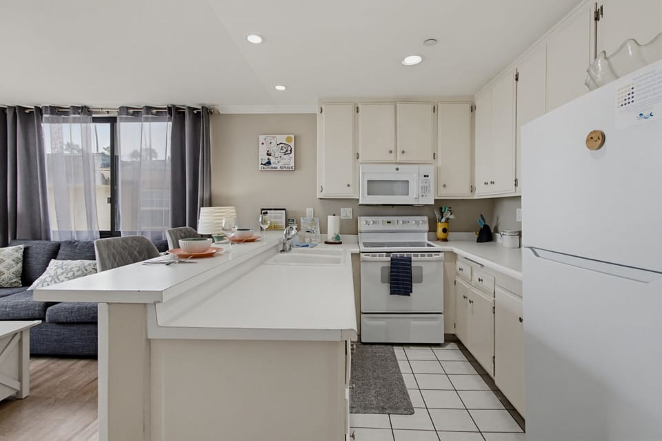 Kitchen has everything you need to enjoy a meal at home! Included appliances: dishwasher, refrigerator, freezer, stove, oven, microwave, coffee maker, blender, and more!