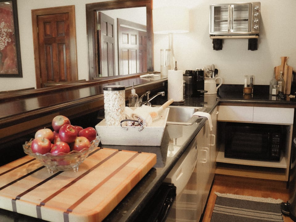 Galley kitchen has all the necessities available for meal prep.