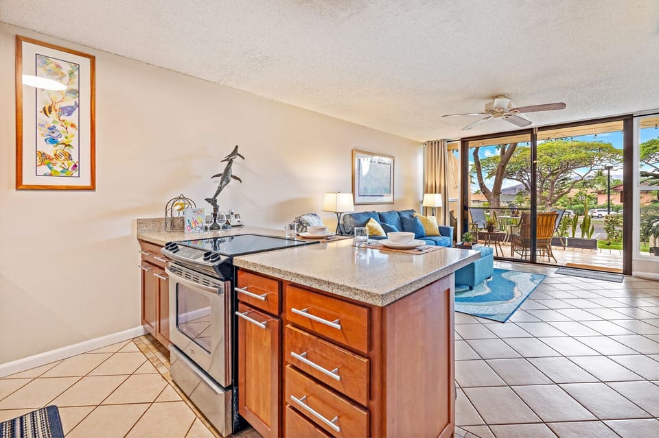 Open concept kitchen with full appliances.