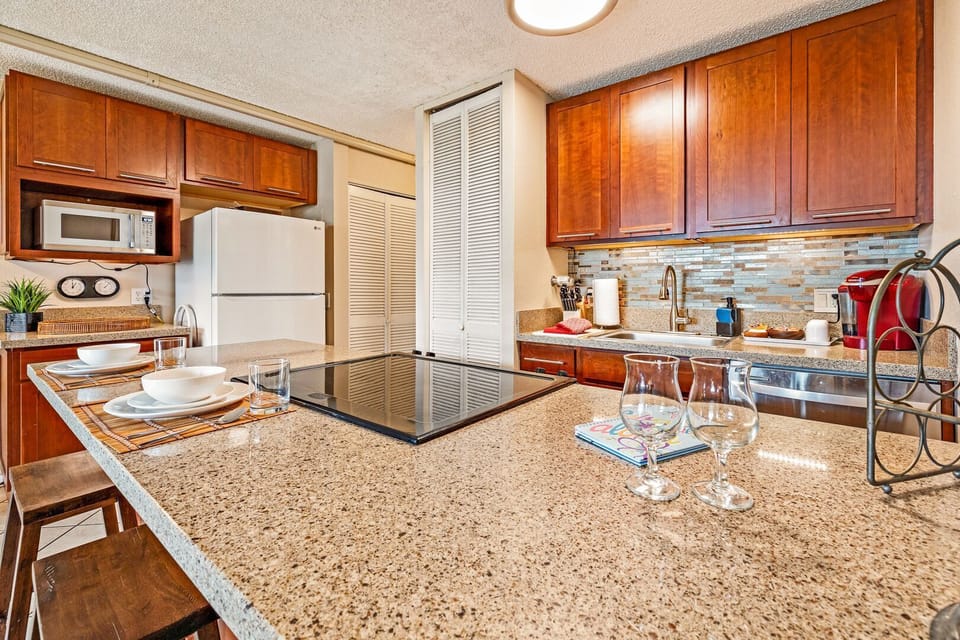 Open concept kitchen with quartz countertops.