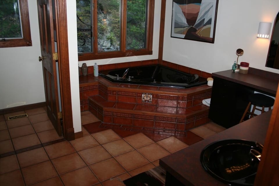 Soaking tub near shower in master bathroom