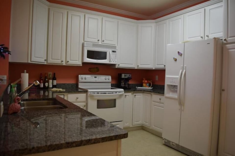 kitchen with breakfast bar and 4 stools (not pictured)
