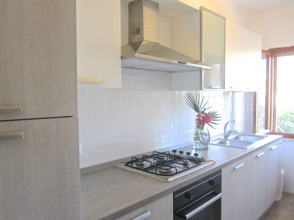 The bright, modern kitchen makes it easy to prep your meals and dine at home.