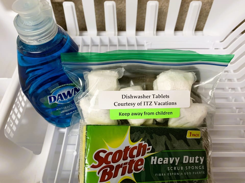 Essential kitchen cleaning supplies ready for your stay