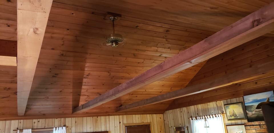 Peaked wooden ceiling with fan