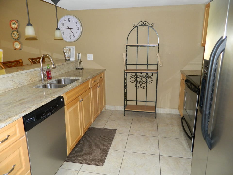 Kitchen area with work area made of granite.