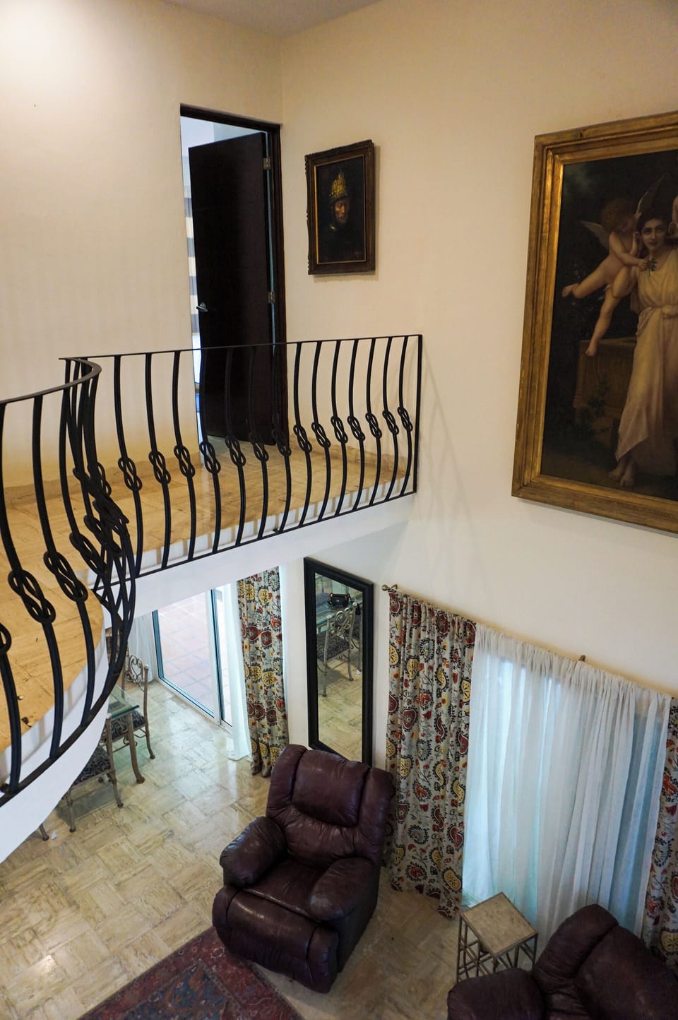 Open-air catwalk providing access to additional bedrooms.