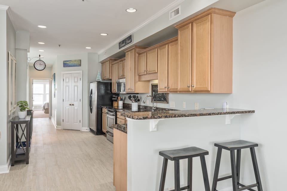 Kitchen area with granite countertops. 