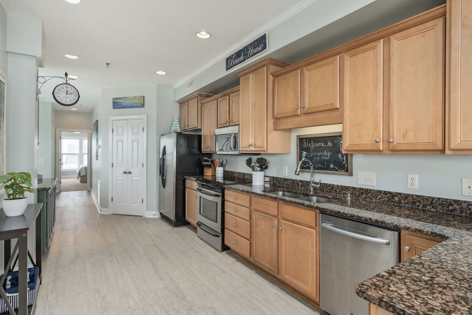 Kitchen with stainless appliances. Kitchen is fully stocked for any chef level. 