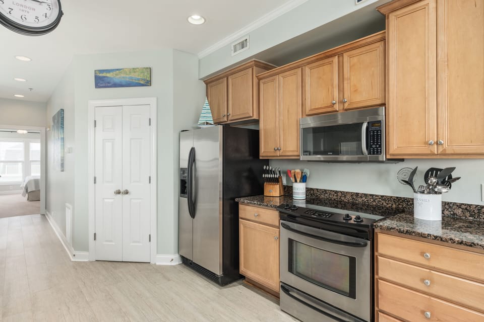 Laundry room with full size stackable washer and dryer. 