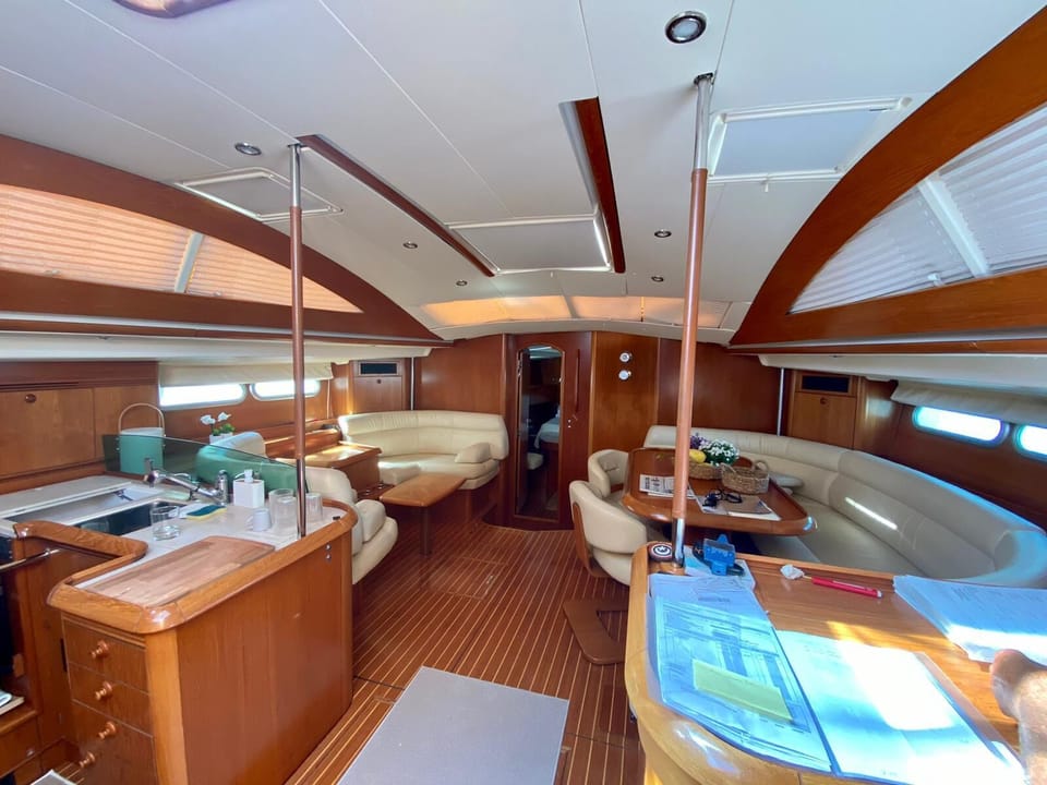 LIVE YOUR DREAM- BOUTIQUE SAILING EXPERIENCE IN GREECE-⛵- NOT A STANDARD CHARTER Docked boat in Santorini