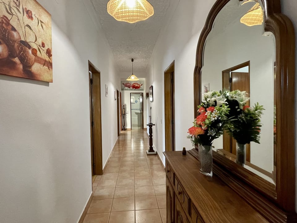 Welcoming, villa entrance & long corridor, to a fully air containing villa. With all the bedrooms, lounge/dinner & kitchen one level, ground floor.