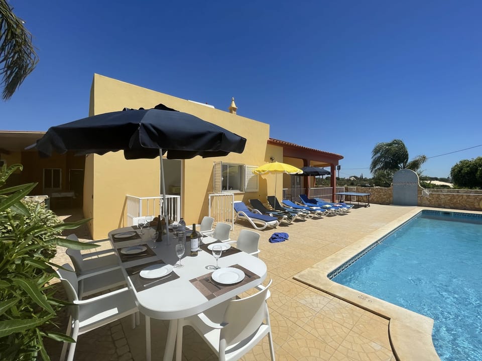 Spacious sunny terrace with ping pong table, large, gated & fenced pool with walk-in Roman steps.