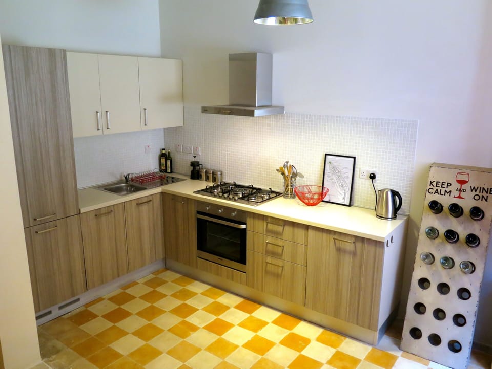 Fully integrated kitchen with dishwasher and wine rack!