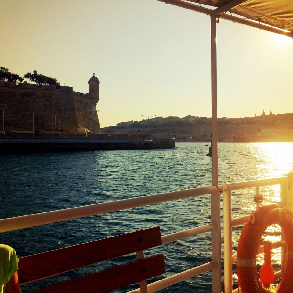 Sunset ferry to Valletta with Gardjola guard tower at Senglea point