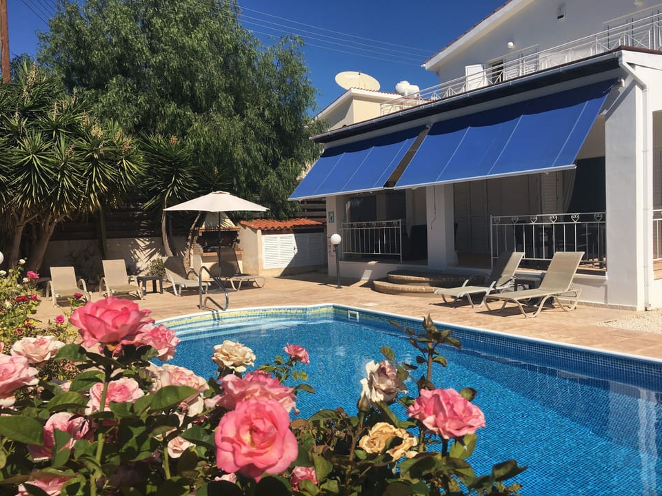 Rear veranda and private pool set in beautiful professionally managed gardens.