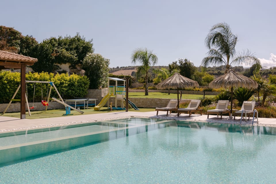 A tranquil poolside escape with dedicated children’s compartment for safe play.