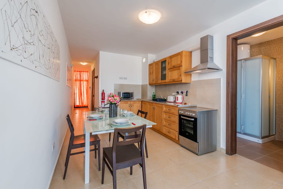 Superior Apartment, Sea View | Private kitchen | Microwave, oven, stovetop, highchair