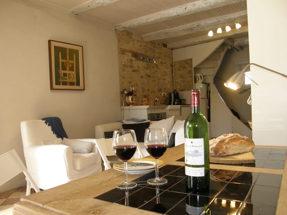 The comfortable front room and kitchen on the ground floor of Maison Felix