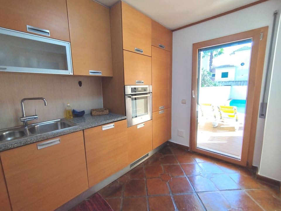 Kitchen opens to pool patio