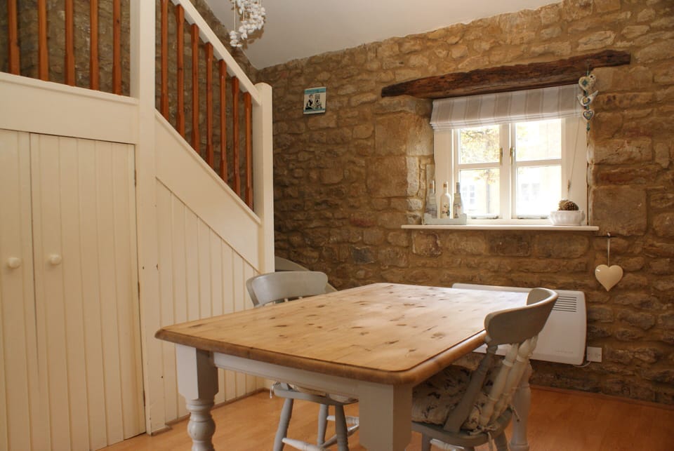 Kitchen dining with stairs to bedroom
