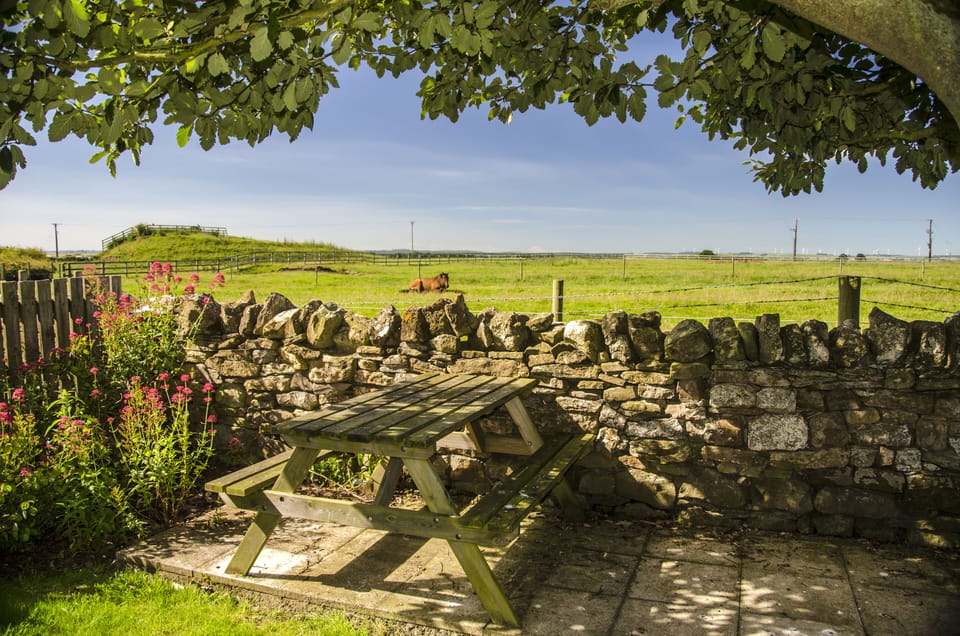 View form the bottom of the Garden with small patio area with Picnic bench